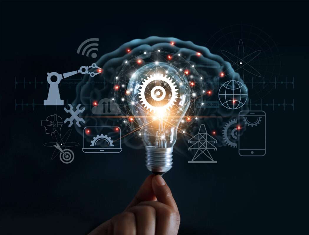 Hand holding light bulb and cog inside and innovation icon network connection on brain background, innovative technology in science and industrial concept